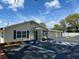 Community center exterior showcasing accessible parking, tidy landscaping, and outdoor access at 715 Surrey Pl, Leesburg, FL 34748