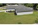 Aerial view of a single-Gathering home showing the backyard, landscaping, and roof at 8635 Se 156 St, Summerfield, FL 34491