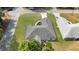 An aerial shot offers a clear view of the well-maintained property and surrounding greenery at 8635 Se 156 St, Summerfield, FL 34491