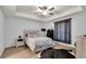Stylish bedroom with modern flooring, fan, and a statement rug at 8635 Se 156 St, Summerfield, FL 34491