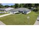 Inviting one story home with a well-manicured lawn, showcasing its curb appeal at 8635 Se 156 St, Summerfield, FL 34491