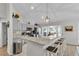 Bright kitchen with a granite countertops and stainless steel appliances at 8635 Se 156 St, Summerfield, FL 34491