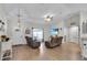 Bright living room featuring wood-look floors and an open floor plan at 8635 Se 156 St, Summerfield, FL 34491