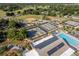 This aerial view showcases tennis and pickleball courts, a baseball field, and a pool with community amenities at 8738 Sw 95Th Ln # B, Ocala, FL 34481