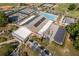 A bird's-eye view highlights the community clubhouse, with tennis courts, pool, and parking at 8738 Sw 95Th Ln # B, Ocala, FL 34481