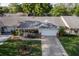 Aerial view of a cozy home featuring a charming front porch and a well-manicured lawn at 8738 Sw 95Th Ln # B, Ocala, FL 34481