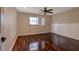 Bright bedroom with hardwood floors, a window, and wainscoting at 8738 Sw 95Th Ln # B, Ocala, FL 34481