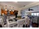 Elegant dining room featuring hardwood floors and a view into the living room and kitchen at 8738 Sw 95Th Ln # B, Ocala, FL 34481
