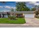 Lovely home exterior featuring well-maintained lawn and a one-car garage at 8738 Sw 95Th Ln # B, Ocala, FL 34481