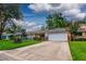Charming home exterior featuring a well-manicured lawn and an attached garage at 8738 Sw 95Th Ln # B, Ocala, FL 34481