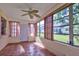 Bright and airy Florida room with tiled floors and multiple windows with a view of the yard at 8738 Sw 95Th Ln # B, Ocala, FL 34481