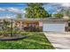 Single-story home featuring an attached garage, cozy front porch, and lovely curb appeal at 8738 Sw 95Th Ln # B, Ocala, FL 34481