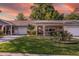 Charming single-story home featuring a well-maintained lawn, garage, and inviting front porch at 8738 Sw 95Th Ln # B, Ocala, FL 34481