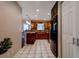Updated kitchen with wood cabinets, tile flooring, and stainless appliances at 8738 Sw 95Th Ln # B, Ocala, FL 34481