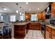 Well-equipped kitchen with stainless steel appliances and wood cabinetry at 8738 Sw 95Th Ln # B, Ocala, FL 34481