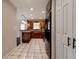 Open kitchen with wood cabinets and tile floors at 8738 Sw 95Th Ln # B, Ocala, FL 34481