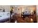 Elegant living room featuring hardwood floors, neutral decor, and ample natural light, creating a warm ambiance at 8738 Sw 95Th Ln # B, Ocala, FL 34481