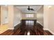 Bright living room featuring gleaming hardwood floors and ample natural light at 8738 Sw 95Th Ln # B, Ocala, FL 34481