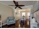Open-concept living space featuring hardwood floors, a dining area, and natural light, ideal for modern living at 8738 Sw 95Th Ln # B, Ocala, FL 34481