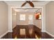 Bright living room features hardwood floors, ceiling fan and open layout to the dining and kitchen area at 8738 Sw 95Th Ln # B, Ocala, FL 34481