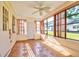 Sunroom offers natural light, tile floors, and many windows to enjoy the outdoors from inside at 8738 Sw 95Th Ln # B, Ocala, FL 34481