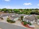 An aerial shot of homes in a well-kept neighborhood showcasing the lovely landscaping and neighborhood design at 8932 Se 168Th Sedgwick Pl, The Villages, FL 32162