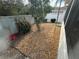 Low maintenance backyard featuring a gravel covering and some decorative shrubbery at 8932 Se 168Th Sedgwick Pl, The Villages, FL 32162
