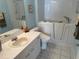 Accessible bathroom with walk-in tub, white vanity, and modern fixtures for convenience and safety at 8932 Se 168Th Sedgwick Pl, The Villages, FL 32162