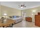 Inviting bedroom with a ceiling fan and tile flooring creating a comfortable and stylish retreat at 8932 Se 168Th Sedgwick Pl, The Villages, FL 32162