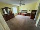 Bedroom features matching dressers, nightstands, and headboard plus a decorative dresser mirror at 8932 Se 168Th Sedgwick Pl, The Villages, FL 32162
