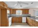 Updated kitchen featuring granite countertops, wood cabinetry, and modern appliances at 8932 Se 168Th Sedgwick Pl, The Villages, FL 32162