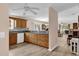 Well-lit kitchen with ample counter space and wood cabinets at 8932 Se 168Th Sedgwick Pl, The Villages, FL 32162