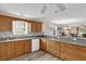Spacious kitchen with updated countertops, wood cabinets, and modern appliances at 8932 Se 168Th Sedgwick Pl, The Villages, FL 32162