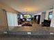Open floor plan shows living room, dining room, and kitchen with updated fixtures and flooring at 8932 Se 168Th Sedgwick Pl, The Villages, FL 32162