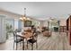 Open concept living and dining area with abundant light and access to the outdoor lanai at 8932 Se 168Th Sedgwick Pl, The Villages, FL 32162