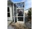 Screen porch featuring an outdoor living space adjacent to a paved walkway at 8932 Se 168Th Sedgwick Pl, The Villages, FL 32162