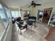 Enclosed sunroom features lots of natural light, tile flooring, and ceiling fan at 8932 Se 168Th Sedgwick Pl, The Villages, FL 32162
