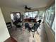 Enclosed sunroom with lots of natural light, tile flooring, and ceiling fan at 8932 Se 168Th Sedgwick Pl, The Villages, FL 32162
