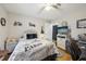 Comfortable bedroom featuring a decorative bed frame, a TV, and a workstation at 1 Aberdeen Cir, Leesburg, FL 34788