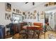 Cozy dining area featuring a round table, decorative wall art, and a ceiling fan at 1 Aberdeen Cir, Leesburg, FL 34788