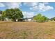 Spacious property with green lawn and mature shade trees at 1 Aberdeen Cir, Leesburg, FL 34788