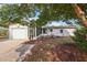 Charming single-story home with a well-manicured front yard and a covered porch at 1 Aberdeen Cir, Leesburg, FL 34788