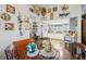 Bright kitchen with stainless steel appliances and light countertops is open to the dining area at 1 Aberdeen Cir, Leesburg, FL 34788