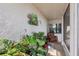 Relaxing enclosed porch with tropical decor and comfortable seating at 1 Aberdeen Cir, Leesburg, FL 34788