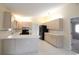Bright kitchen with light cabinets, white countertops, and black appliances at 10442 Se 179Th Pl, Summerfield, FL 34491