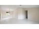 Bright living room with tile flooring, neutral walls, and a chandelier at 10442 Se 179Th Pl, Summerfield, FL 34491