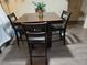 Modern dining table with seating for four; ideal for Gathering meals or entertaining guests at 1051 S Highland St # D-E, Mount Dora, FL 32757