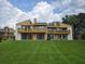Spacious two-story condo with a large lawn and balconies on the second floor at 1051 S Highland St # D-E, Mount Dora, FL 32757