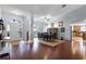 Open-concept entryway showing dining room, hardwood floors, and natural light at 11126 Oakshore Ln, Clermont, FL 34711
