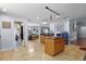 Bright, open kitchen featuring tile floors and a view into the dining room at 11126 Oakshore Ln, Clermont, FL 34711